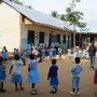 The children of the kindergarten are singing and dancing.